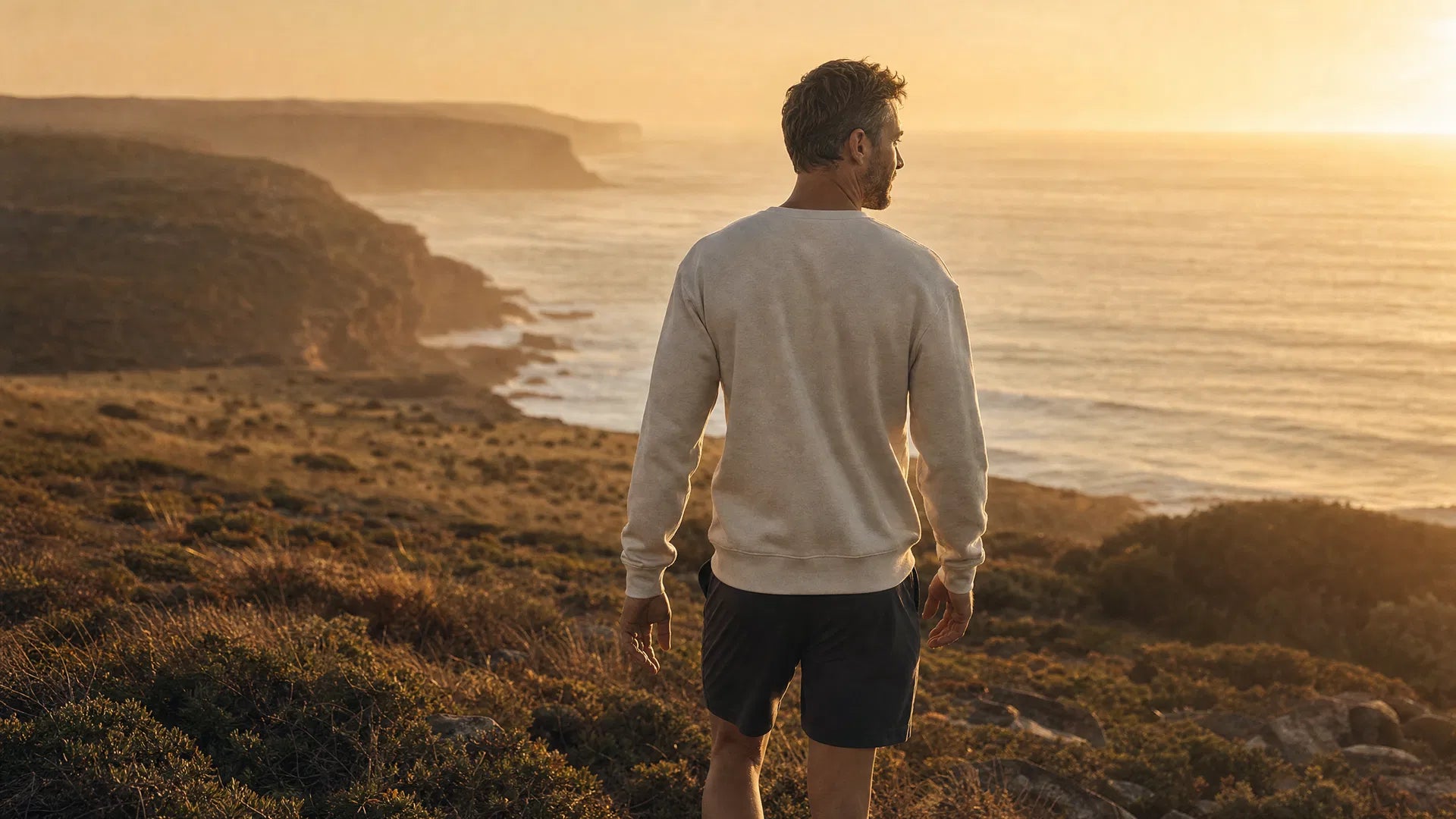 Australian man at sunrise on the coast